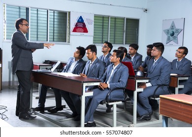 NAGPUR, MAHARASHTRA, INDIA, 13 APRIL 2016 : Unidentified University Professor  Teaching To Young Students Of MBA At The Classroom.