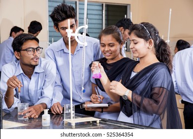 NAGPUR, MAHARASHTRA, INDIA, 9 APRIL 2016 : Unidentified Science Students conducting an experiment and studying together in a laboratory.