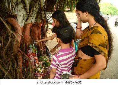 NAGPUR, MAHARASHTRA, INDIA - AUGUST 01 : People worship of Snake God in "Nag Panchami" festival. It is traditional worship of snakes or serpents observed by Hindus in Nagpur, India on 01 August 2014
