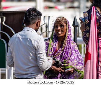 Nagpur, Maharashtra, India - March 2019: A Candid Portrait Of An Elderly Indian Woman Wearing A Sari And Smiling On The Streets Of The City.