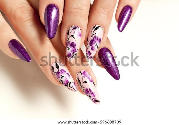Nail
art service. Female manicure and floral
patterns.