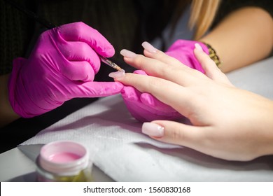 Nail Artist Applying Gel On The Nails