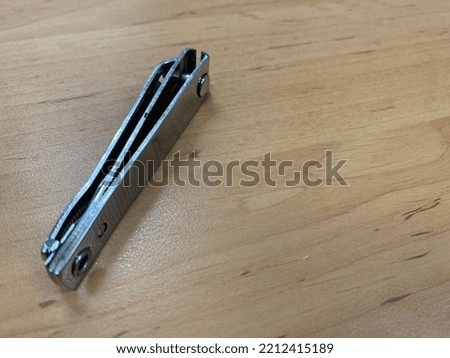 nail clipper on the wooden background