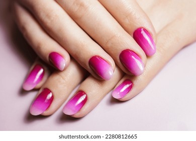 Nail design  manicure and gel polish  Women's hands and gradient pink manicure  
