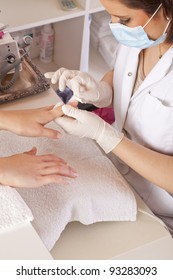 Nail Designer Working On Acrylic Toenails