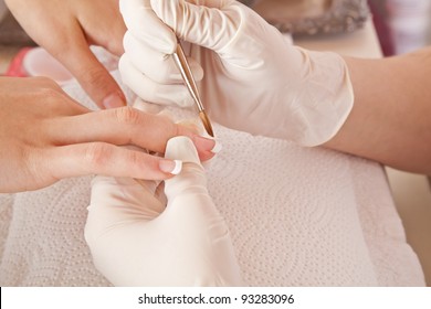 Nail Designer Working On Acrylic Toenails