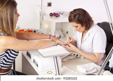 Nail Designer Working On Acrylic Toenails