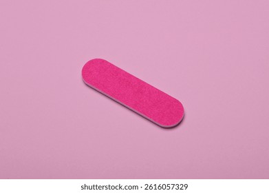 Nail file on a pink background