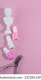 Nail polish and cutter on pinkbackground, manicure set