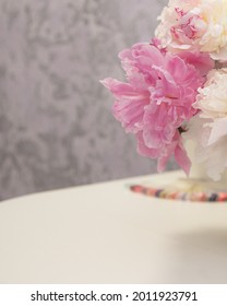 Nail Salon Cabinet Interior. Elegant Peony Flowers In Vase On White Manicurist Table. No People.