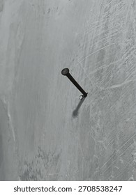 a nail stuck in the wall