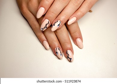 Nails. Beautiful manicure combined with a winter flower. Covering nail gel polish