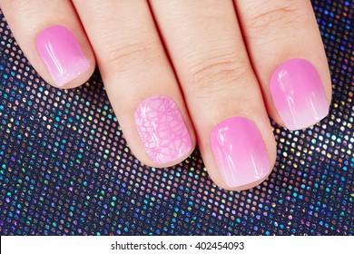 Nails and manicure covered and pink nail polish 
