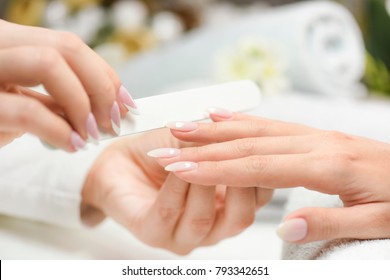 Nails Manicure With File. Woman Beautiful Nail Care. After Filling.