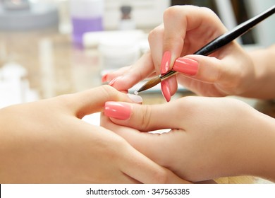 Nails Painting With Brush In Nail Salon Woman Hands