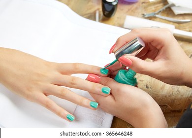 Nails Painting With Brush In Nail Salon Woman Hands