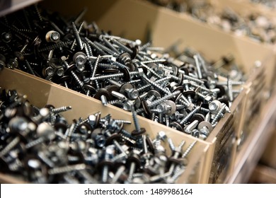 a lot of nails and screws in boxes. tools for repair. men's business. building. hobby . Selective focus