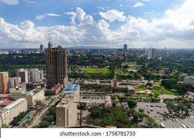 Nairobi, Kenya - 04/28/2018: High Angle View From KICC Tower On Nairobi Skyline, Kenyan Parliament Buildings, Sheria House, Harambee House , Uhuru Park And Upper Hill With Kings Pris Tower.