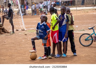 Nairobi, Kenya- 12,08,2021 : Young Boy Football Player Smiling, In Matahre Slum, People Watching A Soccer Game In The Slum, African Slum, East Africa