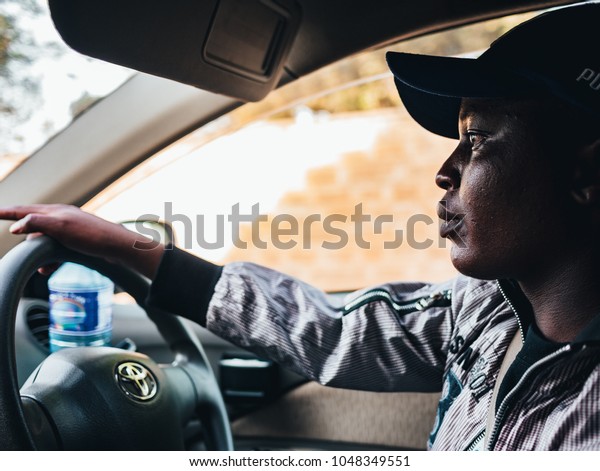 Nairobi /\
Kenya - 9/02/2018 : young driver of\
taxi.