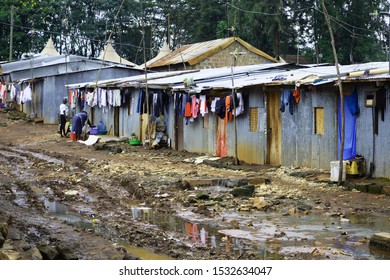 Nairobi, Kenya - April 2018: Shacks in a muddy street of a slum, Nairobi city. 