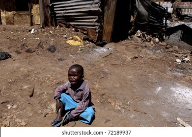 NAIROBI, KENYA - JANUARY 27: An Unidentified Child Living In Poverty On January 27, 2004 In Kibera, Nairobi, Kenya. In The Center Of The Capital, Nairob It Is The Largest Slum In Africa. There Are No Toilets, No Water And The Sewers Are Open.