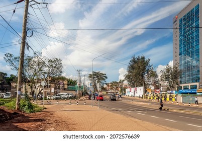 NAIROBI, KENYA - MAY 2014.Street Scene In Nairobi. Cars And People In Street. In Background There Are Buildings, Shops And Advertising Billboards.