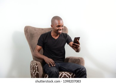 Nairobi/Kenya -Jan 15th 2018: Happy African Model Using A Smart Phone In Kenya