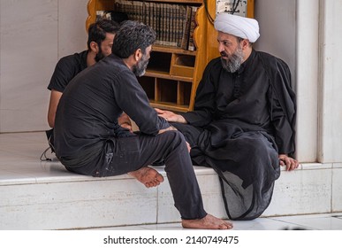 Najaf, Iraq - September 2, 2021: Pilgrims Talking To An Islamic Scholar.