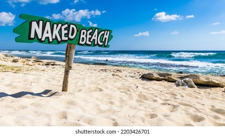Naked Beach Sign In Cozumel Mexico
