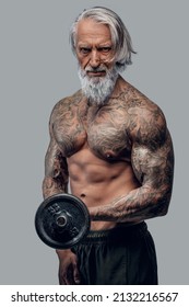 Naked Old Man Lifting Dumbell Against White Background