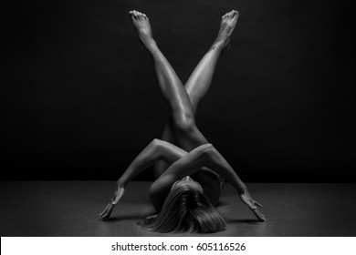 Naked Woman Body On Black Background. Fine Art Photo Of Female Body.