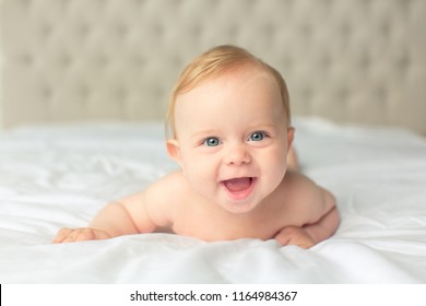 Naket Lovely Little Baby Laying On Th White Cover Naket Lovely Little Baby Laying On Th White Cover