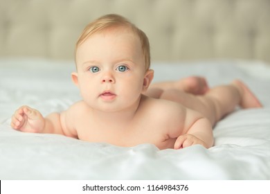 Naket Lovely Little Baby Laying On Th White Cover Naket Lovely Little Baby Laying On Th White Cover