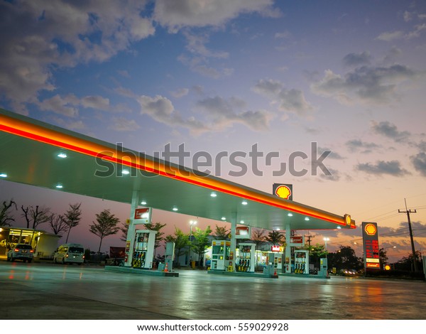 Nakhon Ratchasima, Thailand - December 29, 2016:\
Shell gas station blue sky background during sunset. Royal Dutch\
Shell sold its Australian Shell retail operations to Dutch company\
Vitol in 2014