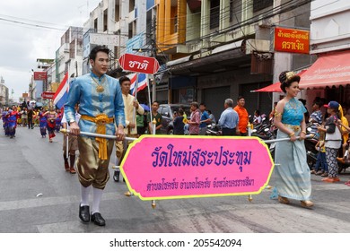 NAKHON RATCHASIMA, THAILAND - JULY 12: Thai people participate parade in grand of opening the traditional candle procession festival of Buddha, on July 12, 2014 in Nakhon Ratchasima, Thailand.