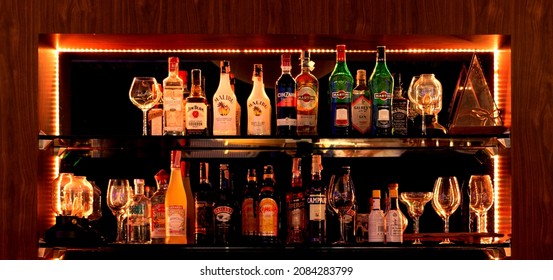 Nakhon Ratchasima, THAILAND- November 26, 2021: Bottles Of Liqour On Shelf In Bar At Night