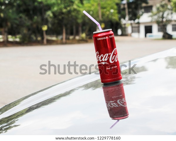  Nakhon Ratchasima, Thailand,\
October 9,2018 ; Coke Coca Cola Red Can on hood skirt\
car.