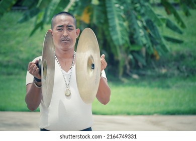 Nakhon Sawan, Thailand, 7 June 2022, A Male Musician Playing Cymbals In An Outdoor Marching Band In The Morning.