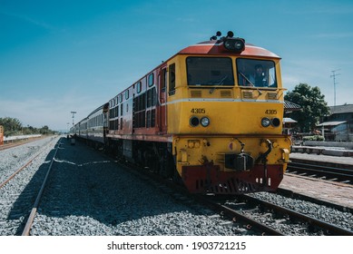 Nakhon Sawan, Thailand - December 19, 2020 : The ordinary train No.201 from Bangkok to Pisanulok at Chansen station.