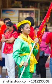 NAKHON SAWAN, THAILAND - FEBRUARY 8 : unidentified asian girl holding flag in Chinese New Year festival on February 8, 2019 in  Nakhon Sawan, Thailand.