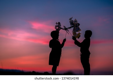 Nakhon Si Thammarat - Thung Na, Behind The University:14 April 2019,the Boys Come Running To Play Along The Rice Fields In The Evening,performing Art Form (Shadow Puppet ThaiNangTalung, In Thailand