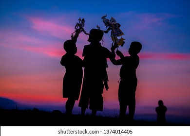 Nakhon Si Thammarat - Thung Na, Behind The University:14 April 2019,the Boys Come Running To Play Along The Rice Fields In The Evening,performing Art Form (Shadow Puppet ThaiNangTalung, In Thailand