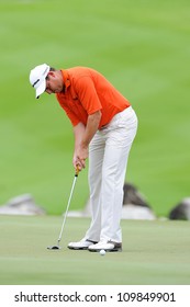 NAKHONPATHOM,THAILA ND-AUG 9:David Howell Of ENG Watches The Ball After Hits A Putt  During Day One Of The Golf Thailand Open At Suwan Golf&Country Club On August 9, 2012 In Nakhonpathom Thailand