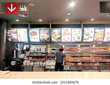 Nakhonsawan ,Thailand - september 23, 2019:
staff working in KFC Fast Food Restaurant without Customer. Kentucky Fried Chicken (KFC) Fast Food at Big-C supercenter with menu and no one Waiting in Line