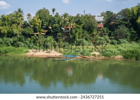 The Nam Khan River, which flows into the Mekong River, is located in Luang Prabang, Laos, Asia.