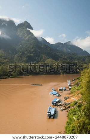 Nam Ou River with karst peaks and lifting mist, Nong Khiaw, Luang Prabang Province, Northern Laos, Laos, Indochina, Southeast Asia, Asia