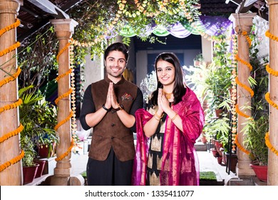 Namaste / Namaskara - Indian Couple Welcoming Guests On Diwali Festival Or Wedding