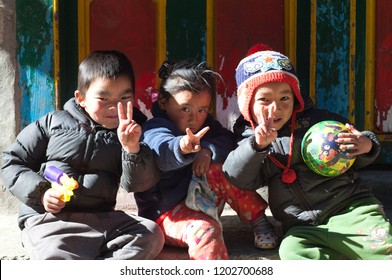 NAMCHE BAZAAR, NEPAL - JANUARY 19, 2017: Nepalese children poses for a photo on the street