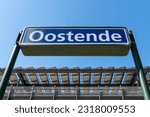 Name board of Oostende city on platform in Ostend railway train station, Belgium.